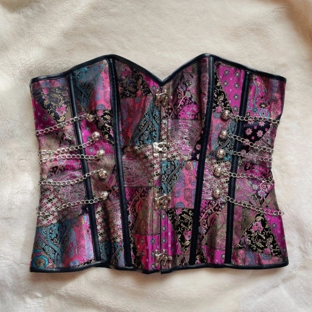 NWOT Steampunk overbust corset with silver front clasp hardware and chains.